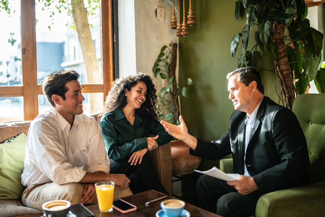 insurance agent speaking with couple